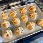 Sourdough hot cross buns topped with a traditional flour cross
