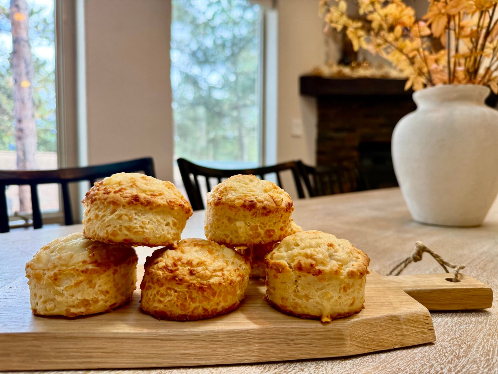 British cheese scones piled up on a wooden serving board