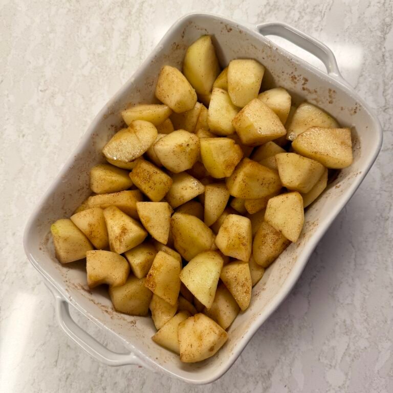 Granny Smith apples in a baking dish before adding the crumble topping